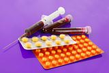 Medical test tubes with blood and medicines on puple