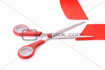 Red ribbon with scissors isolated on white

