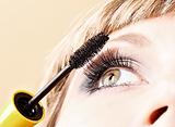 Young woman makeup with mascara eye closeup
