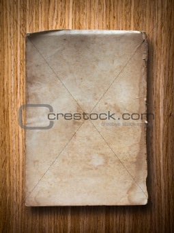 old grunge paper on oak wood