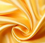 Smooth elegant golden silk as background 