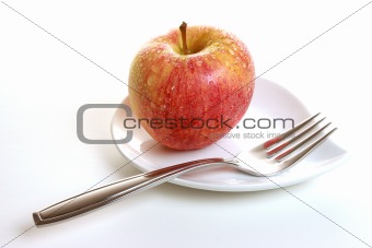 Glistening Gala Apple on Plate with Fork