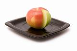 Apple and segment on a plate