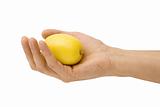 Yellow lemon in a hand