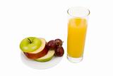 Plate with an apple and a juice glass