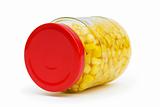 Sweet corn in glass jar isolated on white