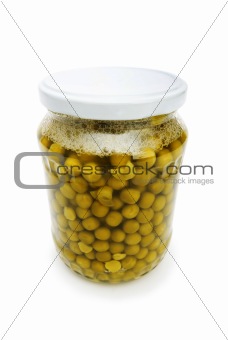 Green peas in glass jar isolated on white