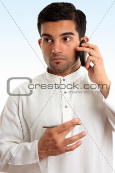 Ethnic business man using phone