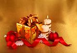 christmas gift in gold box with bow