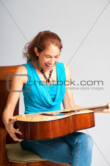 Pretty girl surprised with gift guitar