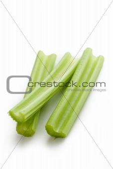 green celery sticks on white background