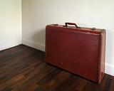 Old Suitcase on wood floor
