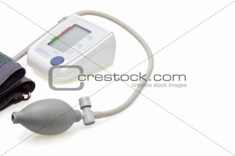 Digital blood pressure meter isolated on white