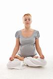 Beautiful pregnant woman doing yoga relaxation