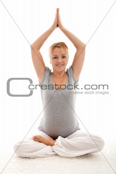 Beautiful pregnant woman doing exercises