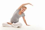 Beautiful pregnant woman doing stretching exercises