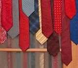 Male ties hung on door