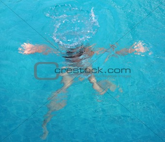Girl under water of the pool