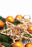 Arrangement with orange Christmas ornaments and gold stars