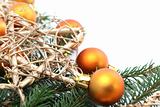 Arrangement with orange Christmas ornaments and gold stars