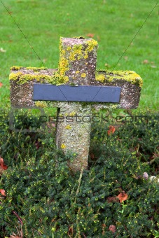 crosses at cemetery in autumn mist
