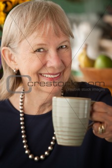 Senior woman with mug