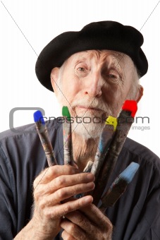 Senior artist with beret and brushes