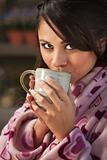 Pretty Hispanic Woman in Bathrobe with Tea or Coffee