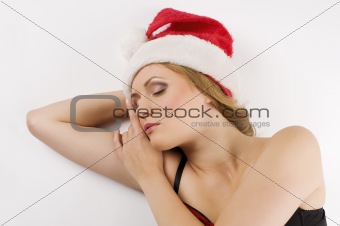 sleeping girl portrait with santa claus hat