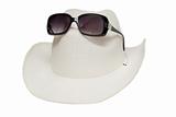 Hat and sunglasses on white background