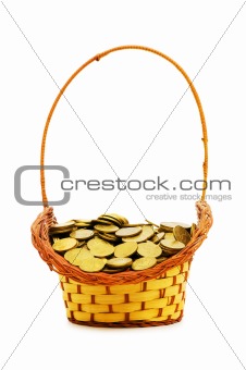 Basket full of coins isolated on white