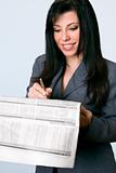 Smiling businesswoman finance newspaper