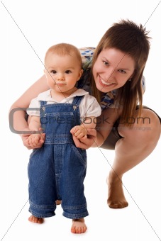 Small child in jeans with mom