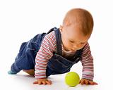 Small child in jeans with tennis ball