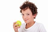boy eating a green apple, isolated on white background