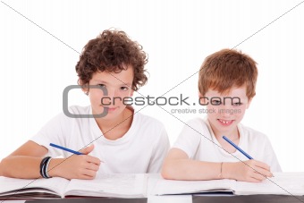Two students with a pencil, writing, isolated on white background