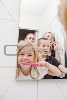 Family brushing teeths