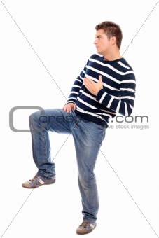 Young man standing on one leg