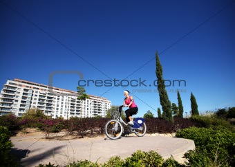 Young woman cycling in the park