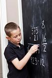 Young Boy in front of the blackboard