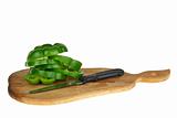 Cutting board with sliced green bell pepper and knife