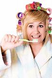 funny housewife with curlers and toothbrush
