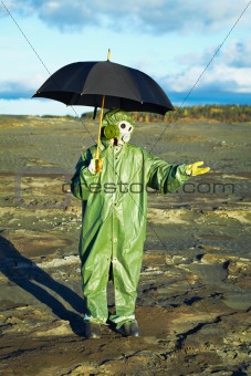 Man in gas mask with umbrella waiting for acid rain