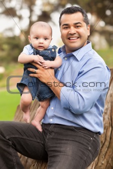 Handsome Hispanic Father and Son Posing for A Portrait in the Park.