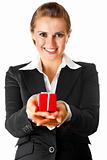 smiling modern business woman holding present in hands 

