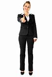 full length portrait  cheerful modern business woman pointing finger at you
