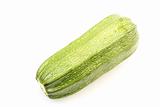 Single green zucchini isolated on white