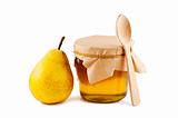 Honey in glass jar, pear, wooden spoon isolated on white backgro