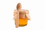 Honey in jar, spoon, isolated white.