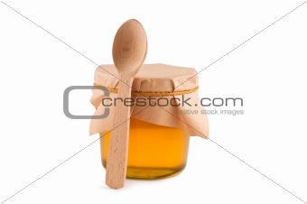Honey in jar, spoon, isolated white.